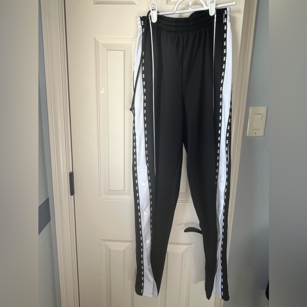 PINK sweatpants in black and white with buttons